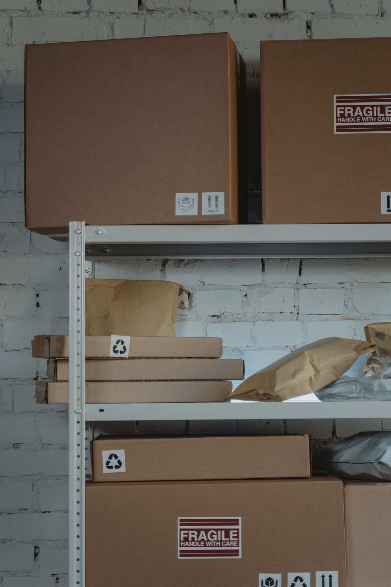 Cardboard shipping cartons stored on steel shelving