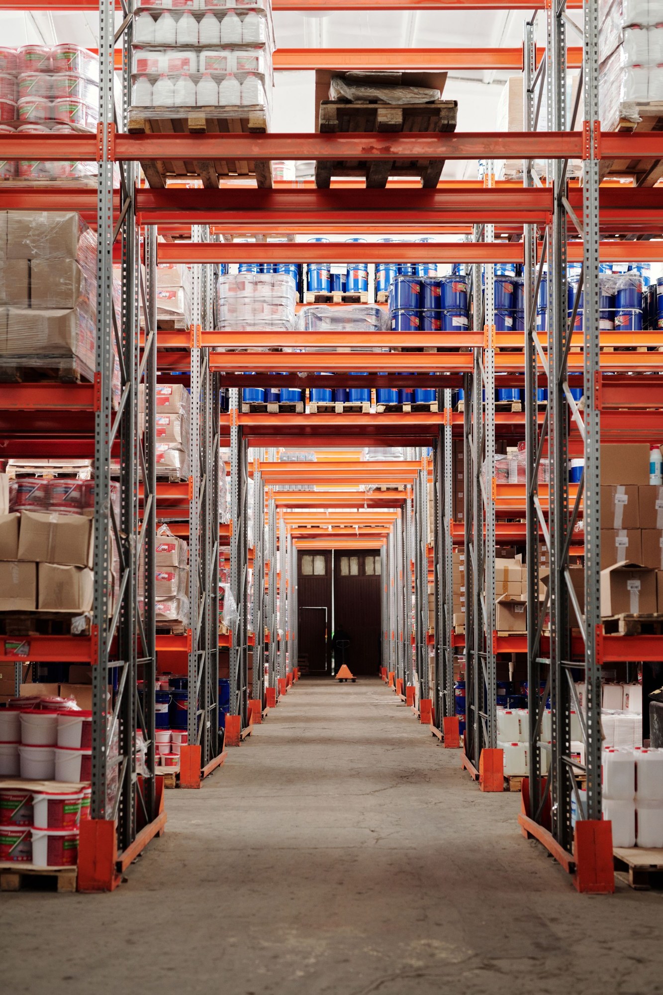 Pallet racks and inventory in a warehouse aisle
